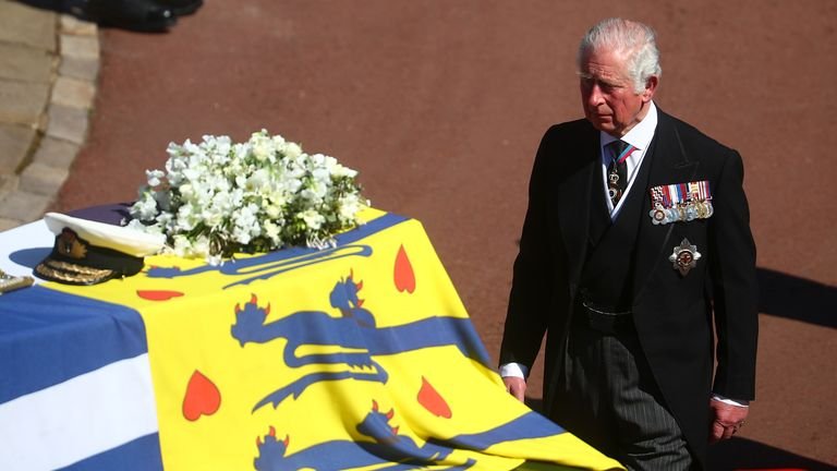 The Prince of Wales walks behind the Duke of Edinburgh's coffin, covered with the personal standard of His Royal Highness, outside St George's Chapel, Windsor Castle, Berkshire, ahead of the Duke of Edinburgh's funeral .  Photo date: Saturday, April 17, 2021.