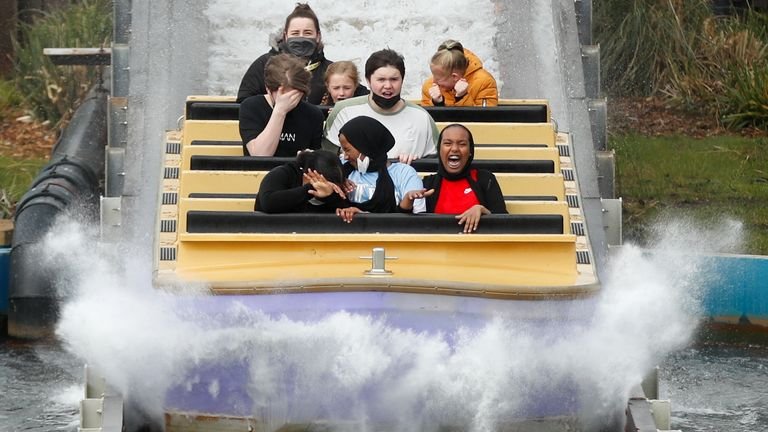 People react on a commute as Thorpe Park reopens after coronavirus disease (COVID-19) restrictions eased in London, Britain April 12, 2021. REUTERS / Matthew Childs