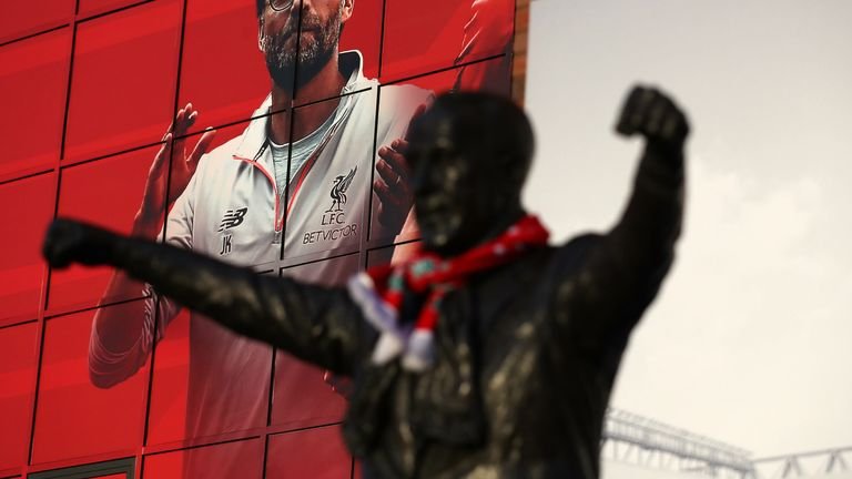 Bill Shankly's statue outside Anfield in 2016 in front of a photo of current manager Jurgen Klopp