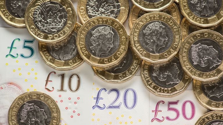 DE 0001 EMBARGOED MONDAY JULY 29 File photo dated 01/26/18 of banknotes and coins.  The national living wage has helped raise the wages of the self-employed even if they are not entitled to receive it, according to a new study.