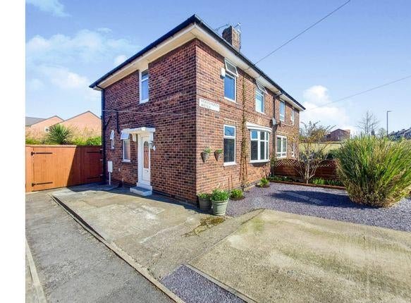 The semi-detached house has a driveway to the front and side access to the huge rear garden.
