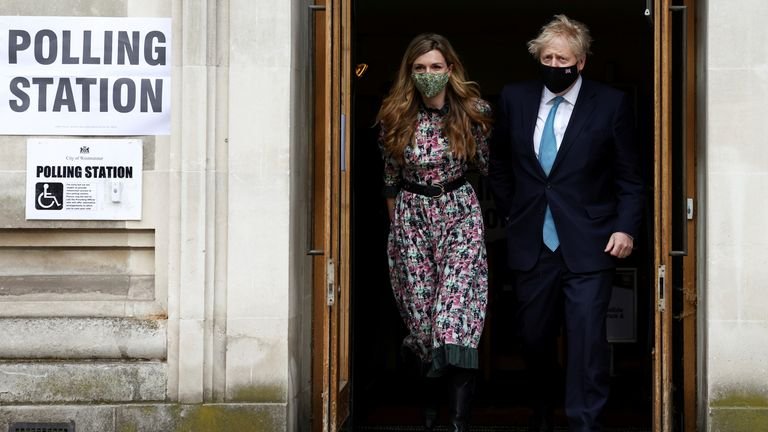 British Prime Minister Boris Johnson and his partner Carrie Symonds leave the Westminster polling station after the vote, in London, Britain on May 6, 2021. REUTERS / Henry Nicholls