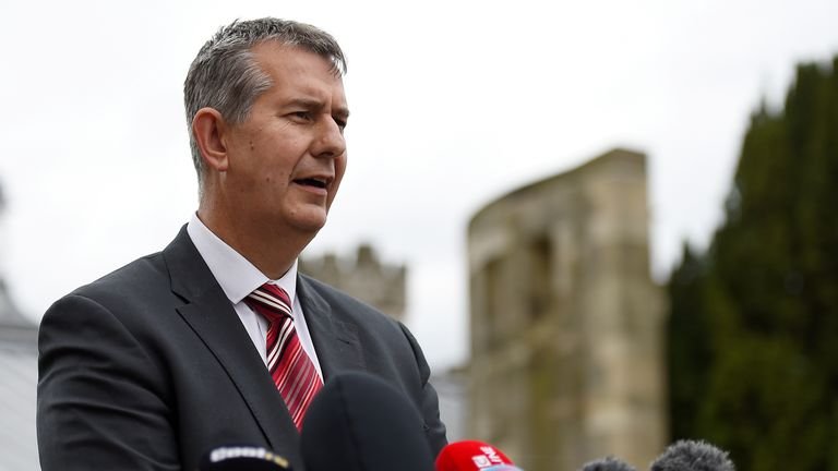 Edwin Poots of the Democratic Unionist Party (DUP) delivers a statement to the media outside Stormont Castle in Belfast