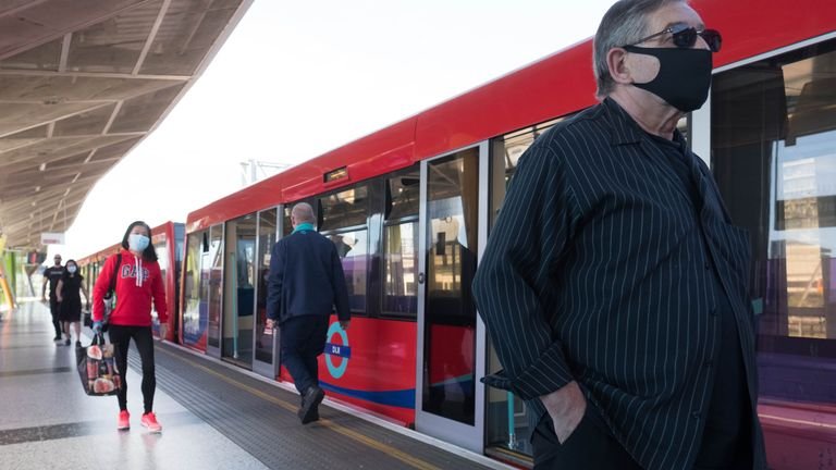 Commuters on the Docklands Light Railway in London after the introduction of measures to get the country out of lockdown.  20/5/2020