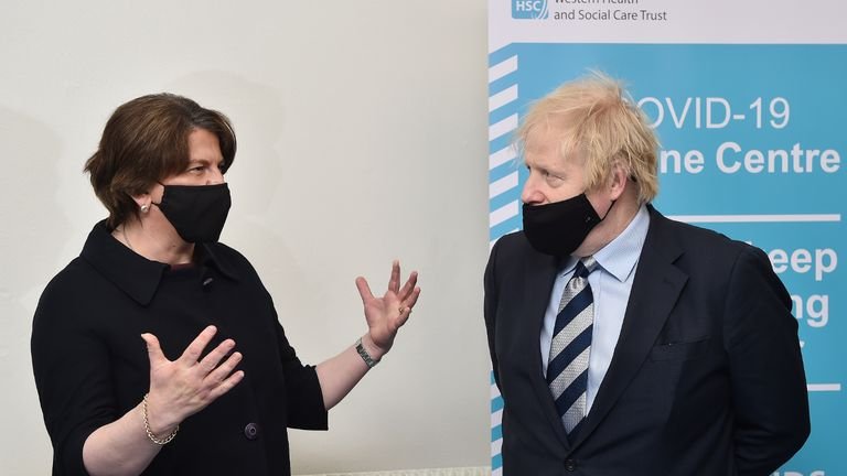 Prime Minister Boris Johnson speaks with Prime Minister Arlene Foster during a visit to the Lakeland Forum vaccination center in Enniskillen, Northern Ireland.  Photo date: Friday, March 12, 2021.