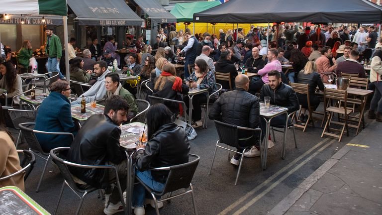 People eat and drink in central London as COVID lockdown restrictions are relaxed
