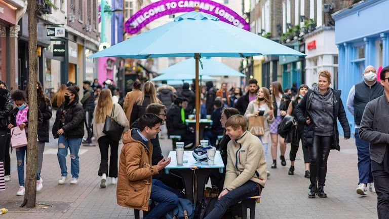 People enjoying food and drink in Carnaby Street.  People in England are flocking to pubs and restaurants as lockdown restrictions were relaxed on Monday April 12.  (Photo by Pietro Recchia / SOPA Images / Sipa USA)