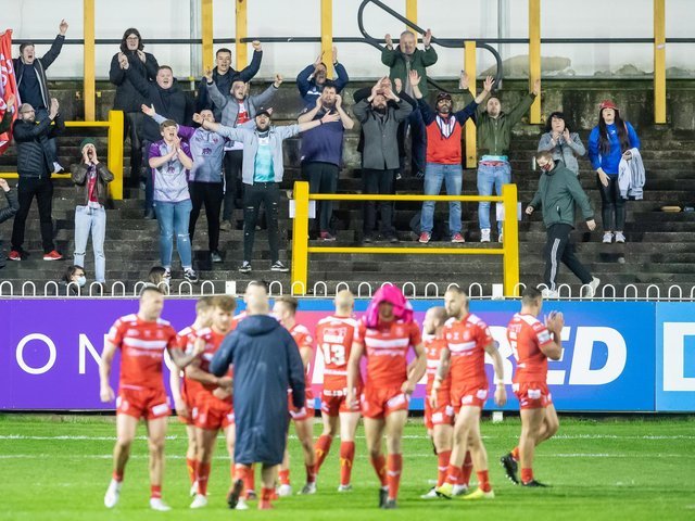 A handful of Hull KR fans who made it into tonight's restricted capacity game at the Castleford Tigers celebrate their team's victory.  (ALLAN MCKENZIE / SWPIX)