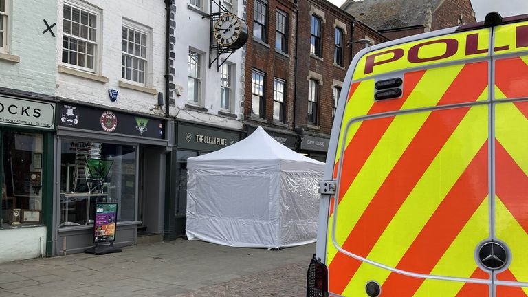 A police tent outside the Clean Plate Cafe in Southgate Street, Gloucester.  Photo date: Tuesday, May 11, 2021.