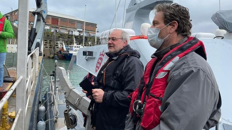 Jersey's Deputy Environment Minister Gregory Guida (left) spoke to French fishermen from a boat