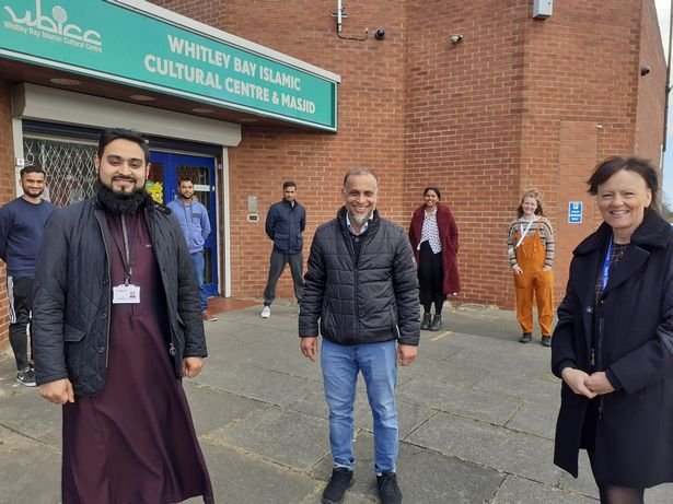 Wendy Burke at the Whitley Bay Islamic Cultural Center (front right), pictured with Imam Syed Al Amin (front left) and center community leader Misbah Hanan (front right) with volunteers helping run the testing site.