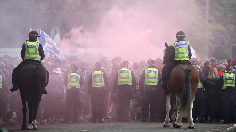 Police and Rangers fans off the ground before the Scottish Premiership match at Ibrox Stadium, Glasgow.  Photo date: Saturday, May 15, 2021.
