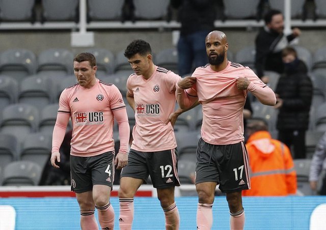 Too Many: The Blades trio of John Fleck, left, John Egan, center, and David McGoldrick, right, look dejected after Newcastle opened the scoring.  (Image: Darren Staples / SportImage)