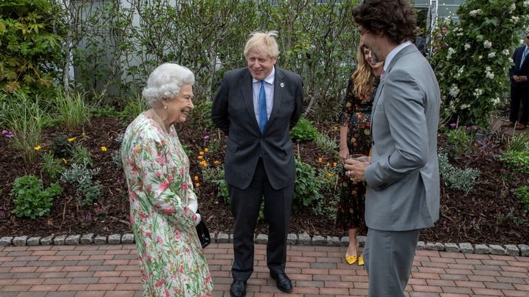 British Queen Elizabeth, Canadian Prime Minister Justin Trudeau and British Prime Minister Boris Johnson attend a cocktail party on the sidelines of the G7 summit at the Eden Project in Cornwall, Britain on June 11.  2021. Jack Hill / Pool via REUTERS