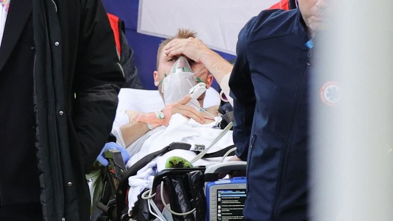 Eriksen seemed conscious as he lay on a stretcher.  Photo: Getty