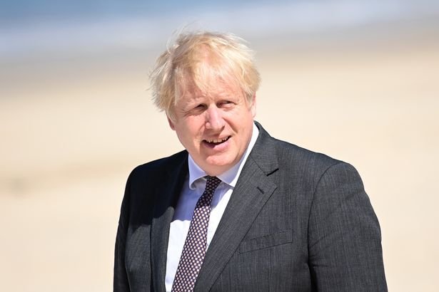 Prime Minister Boris Johnson, pictured in Cornwall ahead of his return to London, where he is expected to approve a plan to extend the lockdown