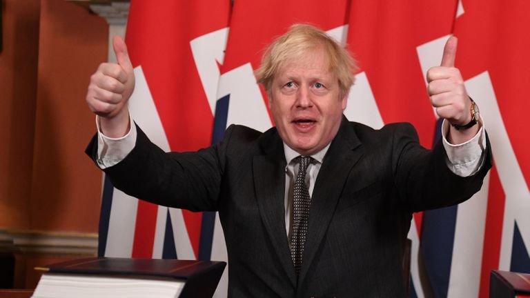 Prime Minister Boris Johnson gives a thumbs up after signing the EU-UK trade and cooperation agreement at 10 Downing Street, Westminster.