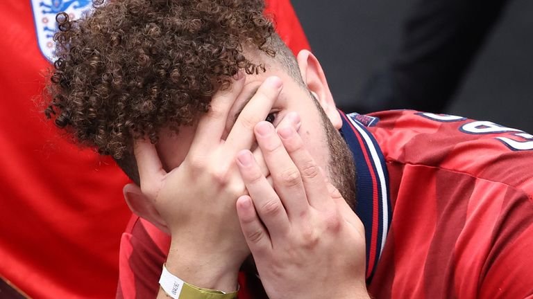 An English fan can barely watch in the first half, as England and Germany draw in the first half