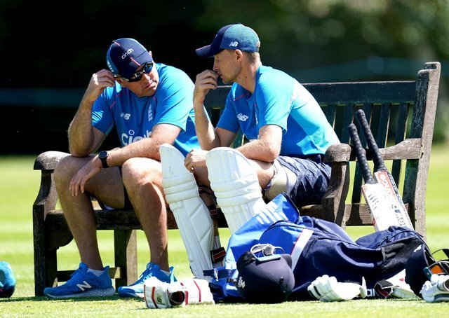Careful whispers: England captain Joe Root, right, and coach Chris Silverwood, left, share some thoughts during a break in the nets session in Edgbaston yesterday.  (Image: PA)