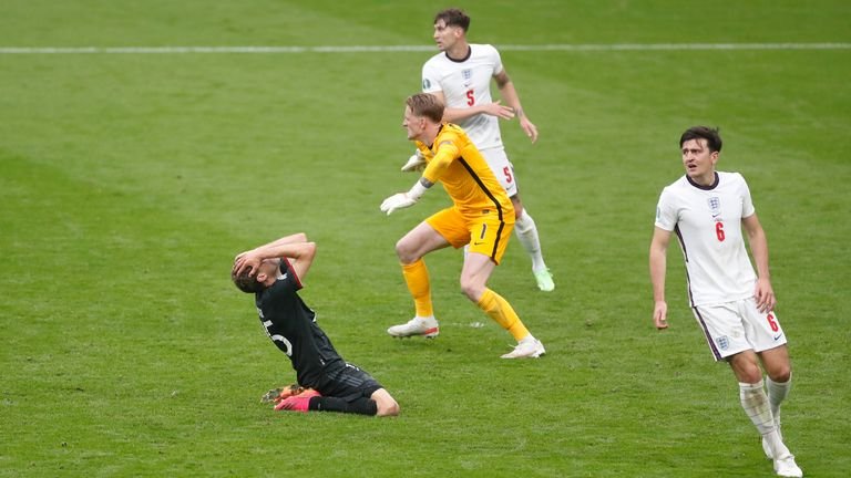 Thomas Mueller holds his head in his hands after missing a golden opportunity to equalize