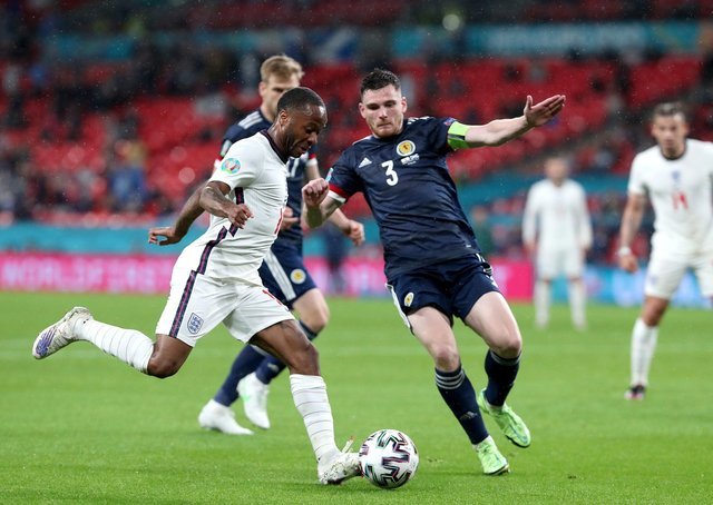 England's Raheem Sterling (left) and Scotsman Andrew Robertson battle for the ball at Wembley Stadium on Friday night.  Image: Nick Potts / PA