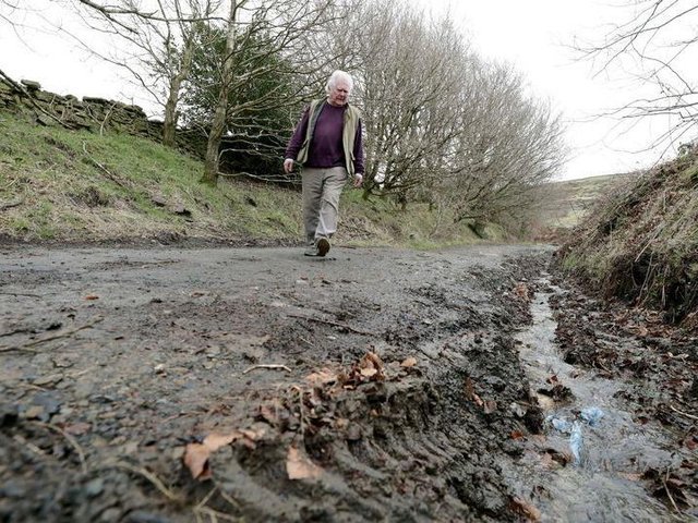 Holme Valley South Councilor Donald Firth inspects damage to a green lane route used by bicyclists and 4x4 drivers. (Image: Andy Catchpool)