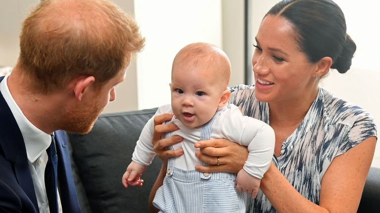 File photo dated 25/09/2019 of the Duke and Duchess of Sussex holding their son Archie during a meeting with Archbishop Desmond Tutu and Ms Tutu at their heritage foundation in Cape Town on day three of their tour in Africa.  Meghan and Harry will be celebrating their son's second birthday, who helped inspire his mother's new picture book.  Issue date: Thursday, May 6, 2021.