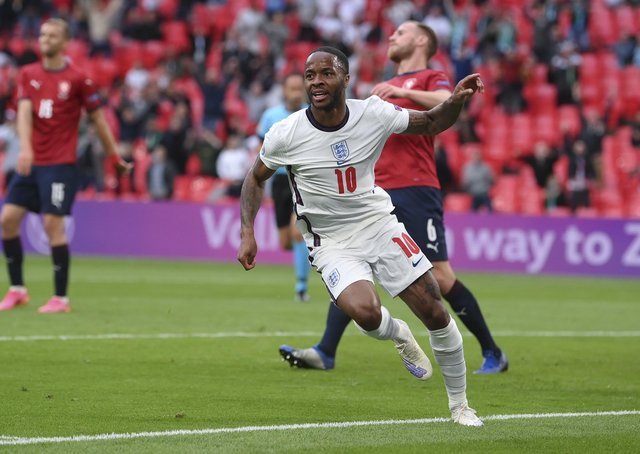 Raheem Sterling of England celebrates after scoring his team's winning goal.  (AP Photo / Laurence Griffiths, Group)