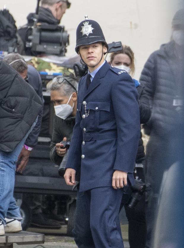 The Argus: May 4, 2021 ... Harry Styles is seen shooting scenes for his new film The Policeman which also stars Emma Corrin ... Credit: GoffPhotos.com Ref: KGC-102.