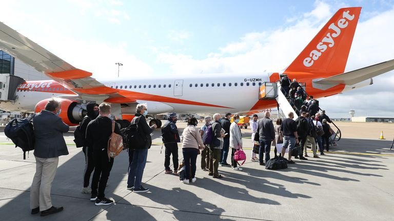 Gatwick Airport passengers board a flight to Faro, Portugal