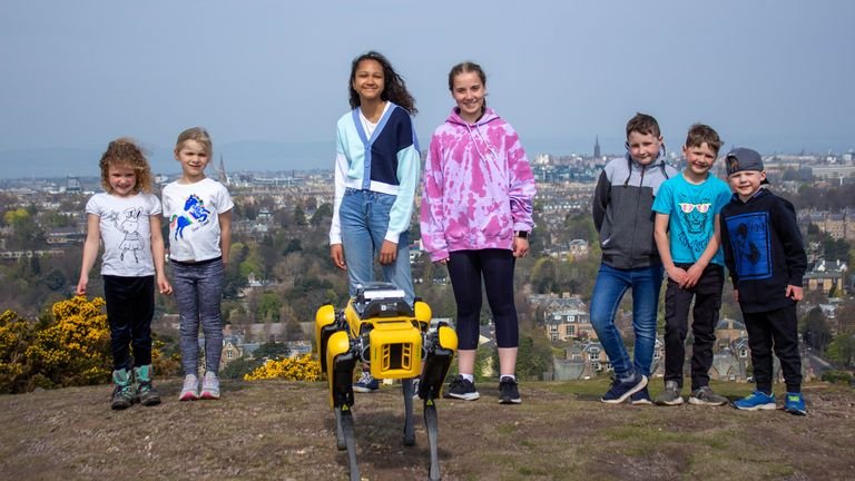 Schoolchildren with the robot dog helping scientists with their research in Scotland