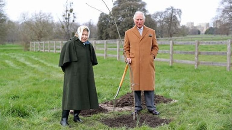 Queen Elizabeth II and the Prince of Wales plant the first jubilee tree to mark the Queen's Platinum Jubilee in the grounds of Windsor Castle in Berkshire earlier this year.