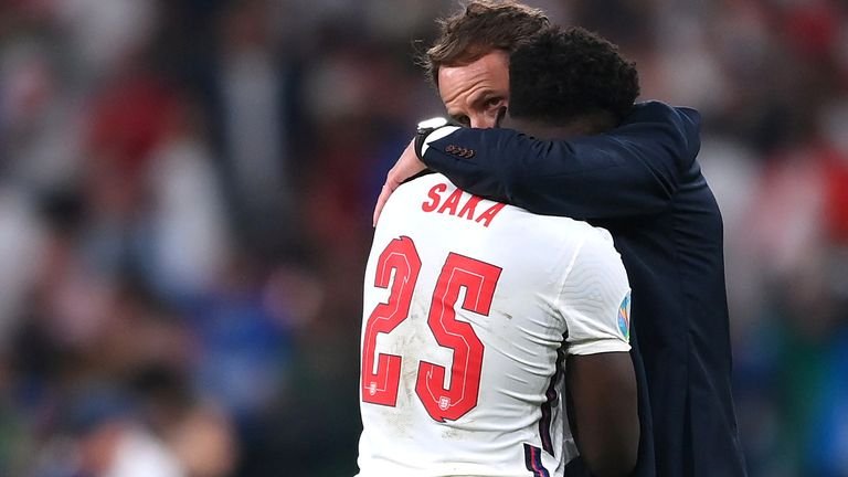 England Bukayo Saka with manager Gareth Southgate after the match