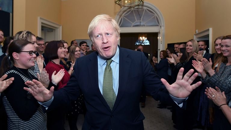 Prime Minister Boris Johnson is greeted by staff on his return to 10 Downing Street, London, after meeting Queen Elizabeth II and accepting her invitation to form a new government following the return to power of the Conservative Party in the general election with a increased majority.  Photo by the AP.  Picture date: Friday December 13, 2019. See the election politics of PA history.  Photo credit should read: Stefan Rousseau / PA Wire
