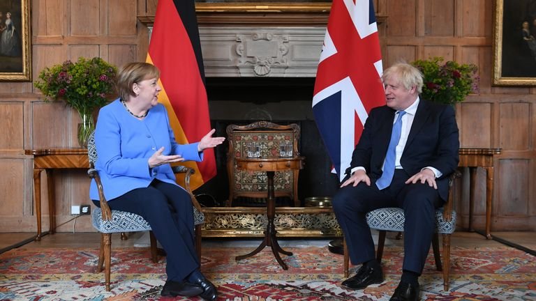 Prime Minister Boris Johnson with German Chancellor Angela Merkel ahead of their bilateral meeting at Checkers, the UK Prime Minister's country house, in Buckinghamshire.  Photo date: Friday, July 2, 2021.