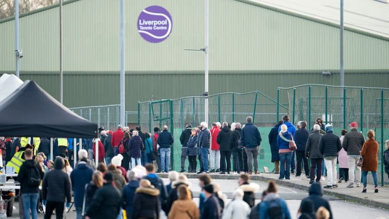 Members of the public queue at Wavertree Sports Park in Liverpool on November 6, 2020