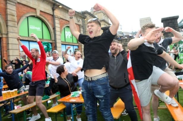 England supporters in Newcastle celebrate Germany's victory