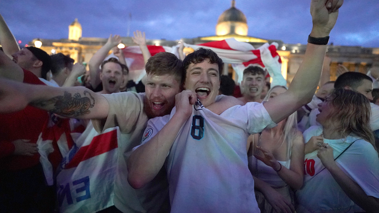Fans in Trafalgar Square, London, celebrate England's 4-0 victory over Ukraine in their Euro2020 quarter-final match.  Picture date: Saturday July 3, 2021.