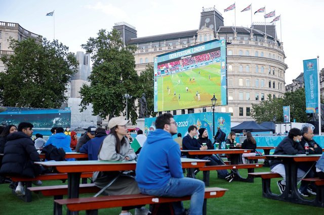 Football fans watch the UEFA EURO 2020 semi-final soccer match between Spain and Italy, at FanZone in Trafalgar Square, central London on July 6, 2021 (Photo by Tolga Akmen / AFP) (Photo by TOLGA AKMEN / AFP via Getty Images)