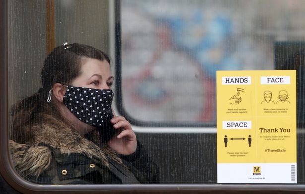 A subway passenger wearing a mask at Pelaw station