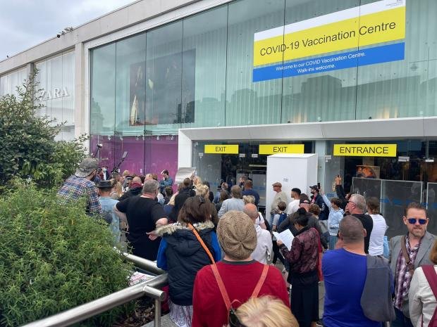 The Argus: Protesters gathered at the new vaccination center at the former Topshop store in Churchill Square