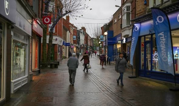 People shop in Oswestry on a bad winter day as candidates in the North Shropshire by-election campaign for the votes
