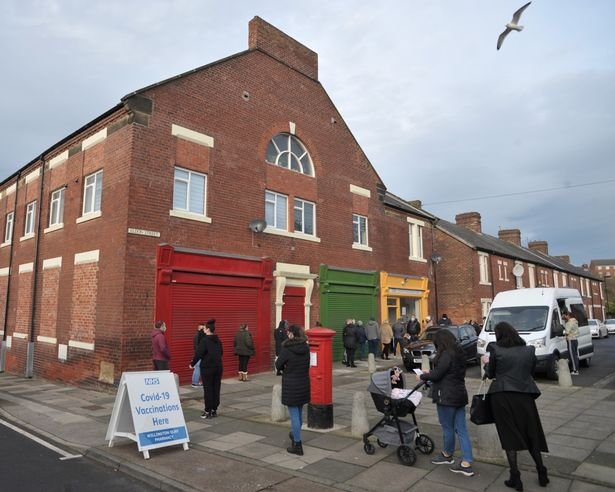 Members of the public queuing for their Covid booster vaccination outside the Covid-19 vaccination clinic at Willington Quay Pharmacy in North Tyneside