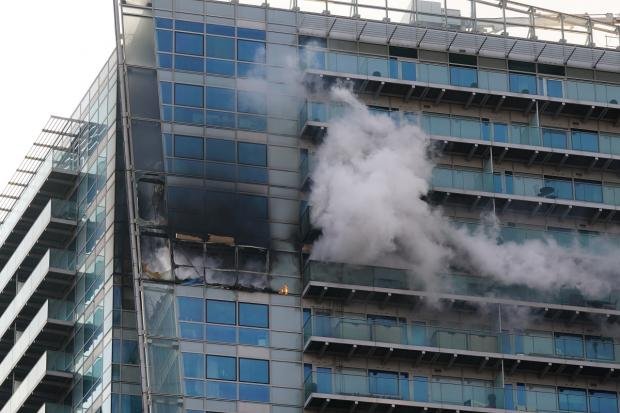 Times Series: The fire started on the 17th floor of the building in Whitechapel High Street.  Photo: PA