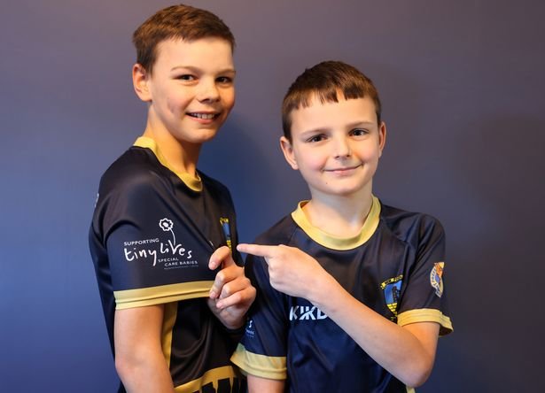 Cory and Harry in their New Fordley Juniors Football Club tops, which now feature the Tiny Lives logo on the sleeves in memory of their brother Frankie Foster