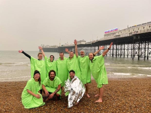 The Argus: Oban International employees after swimming in the sea near Brighton Palace Pier