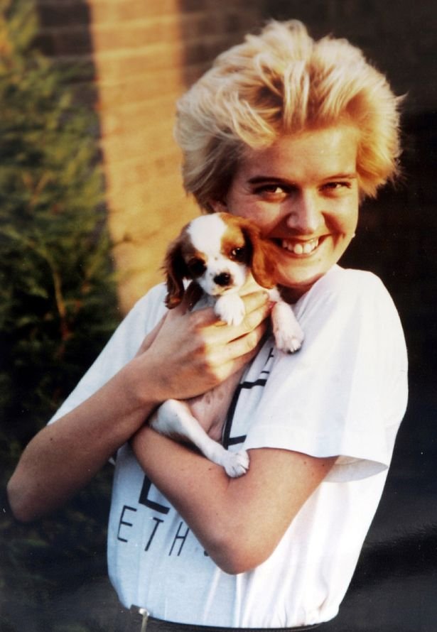 Old photo of Joanne Tulip cuddling a puppy