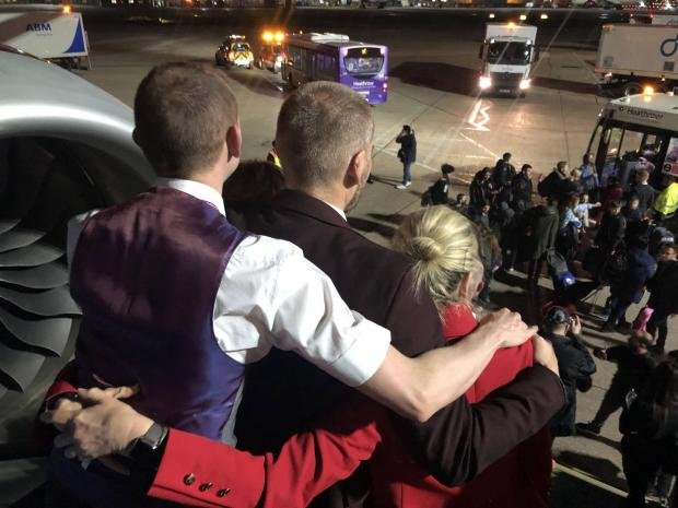 Times Series: Virgin Atlantic staff embrace.  Credit: Virgin Atlantic