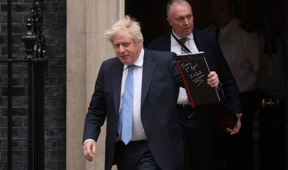 Boris Johnson leaves 10 Downing Street for the Houses of Parliament